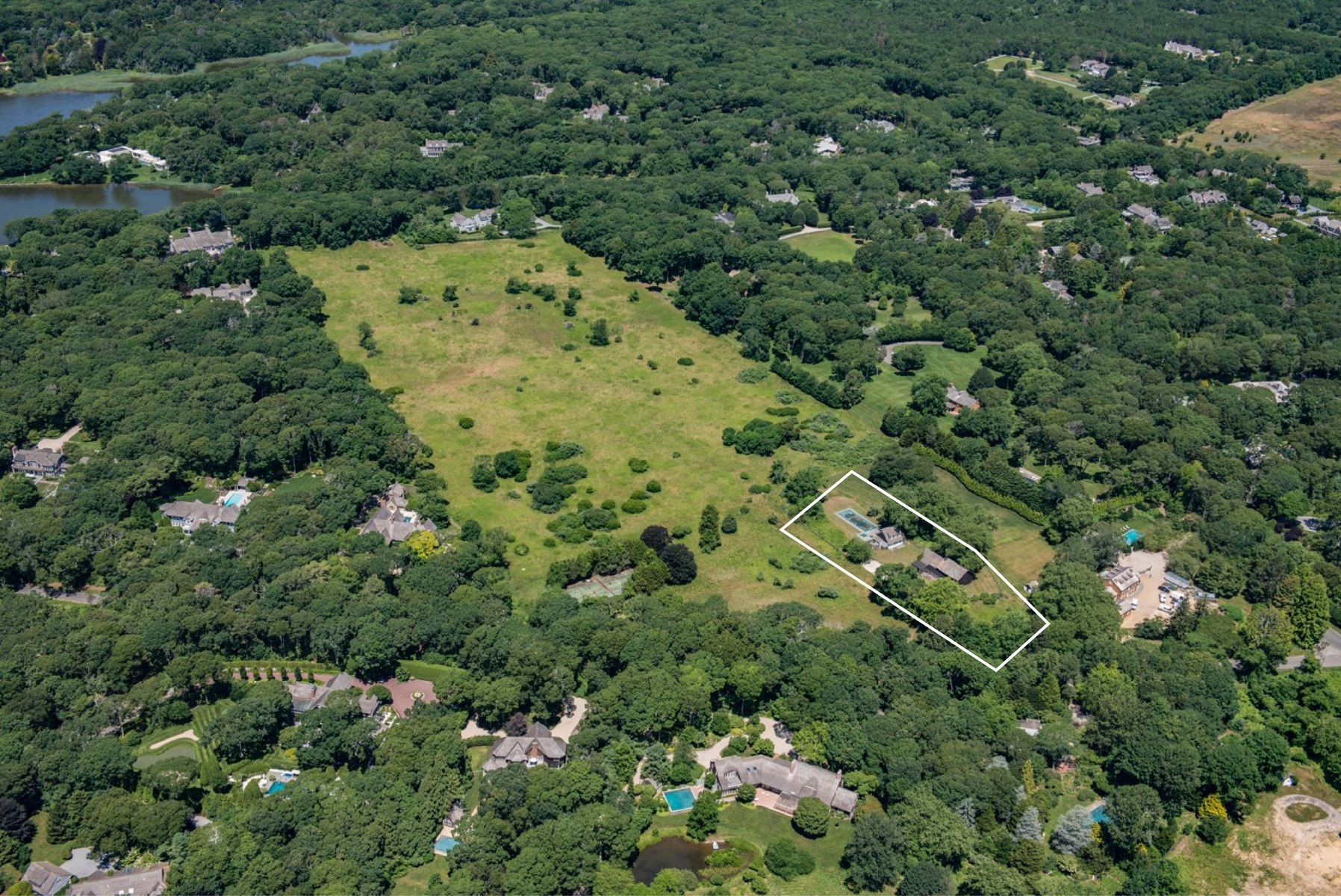 10 B Briar Patch Road East Hampton, NY 11937 - Photo 2 of 5 an aerial view of a house with a yard