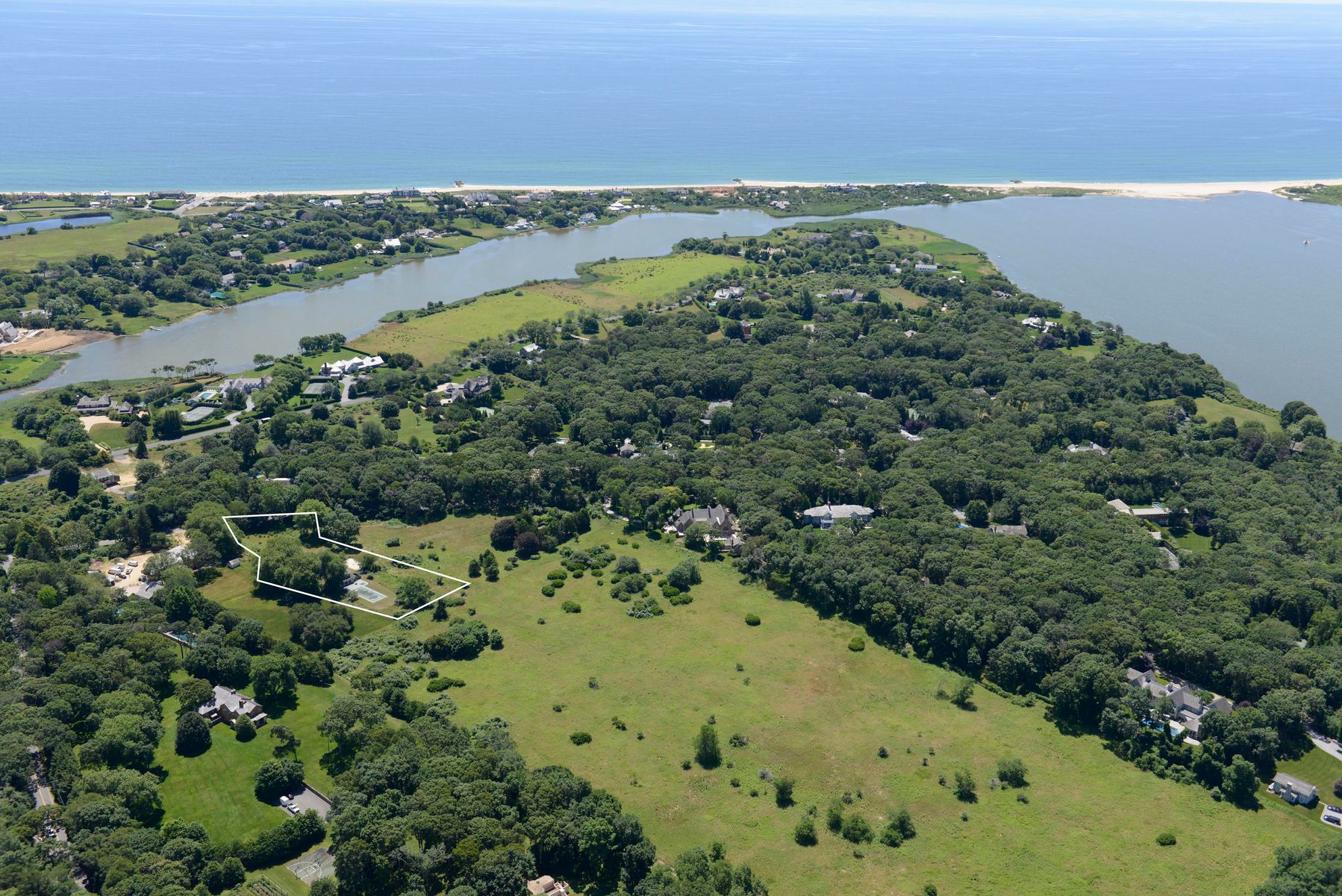 10 B Briar Patch Road East Hampton, NY 11937 - Photo 5 of 5 a view of a lake with a city