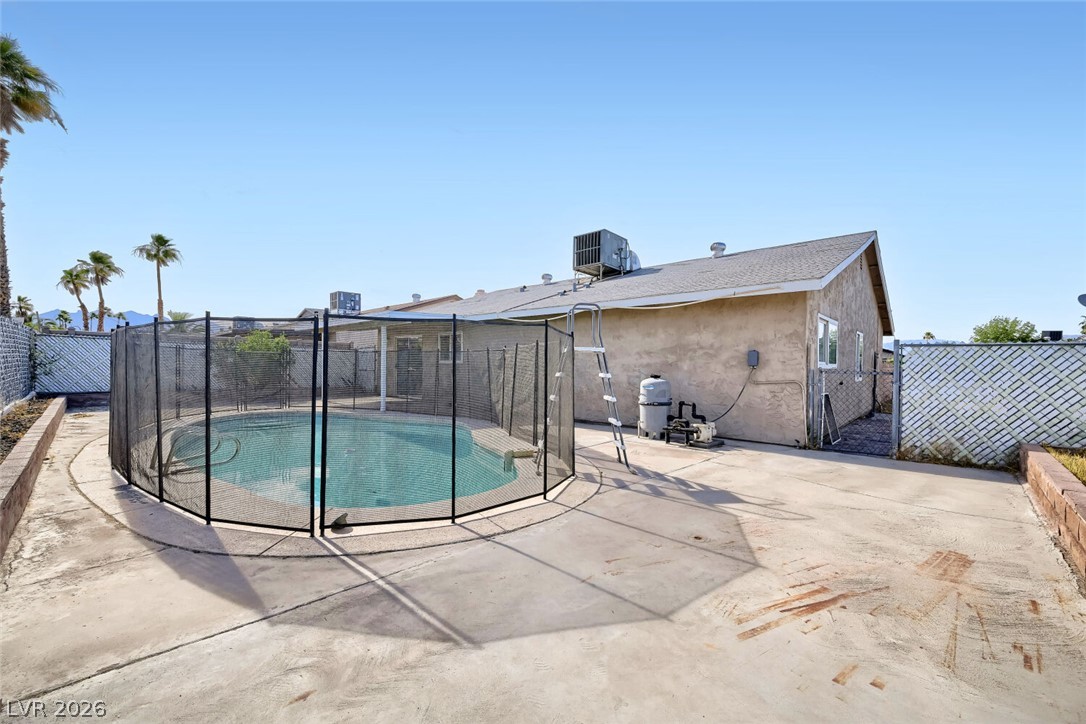 6321 Portola Road Las Vegas, NV 89108 - Photo 28 of 29 A private pool with secure fencing offers refreshing leisure in the backyard oasis.