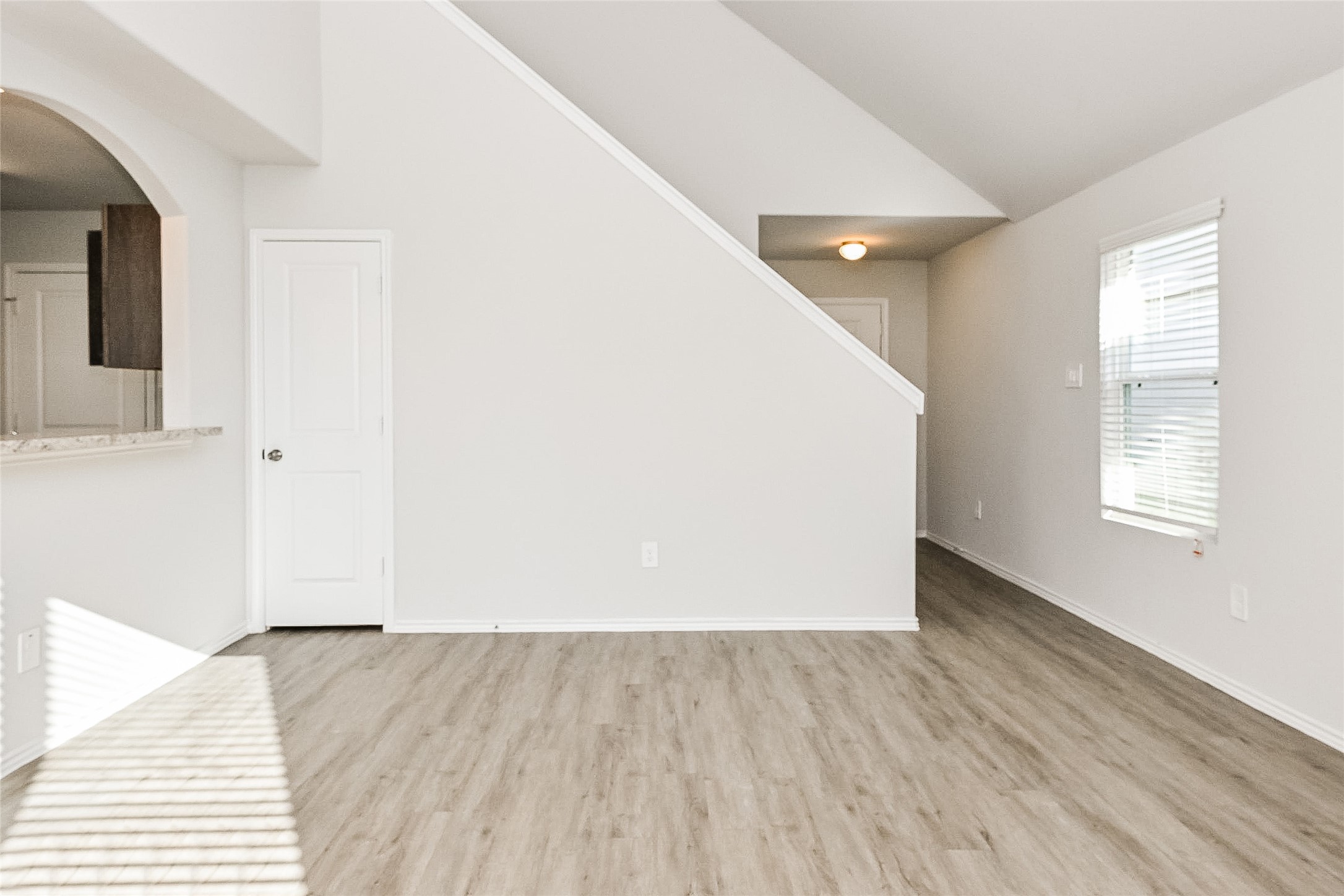 4911 Sweet Chestnut Lane Spring, TX 77373 - Photo 4 of 18 an empty room with wooden floor and windows