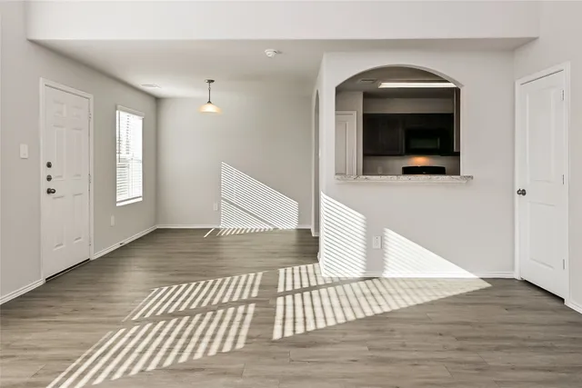 a view of a livingroom with wooden floor