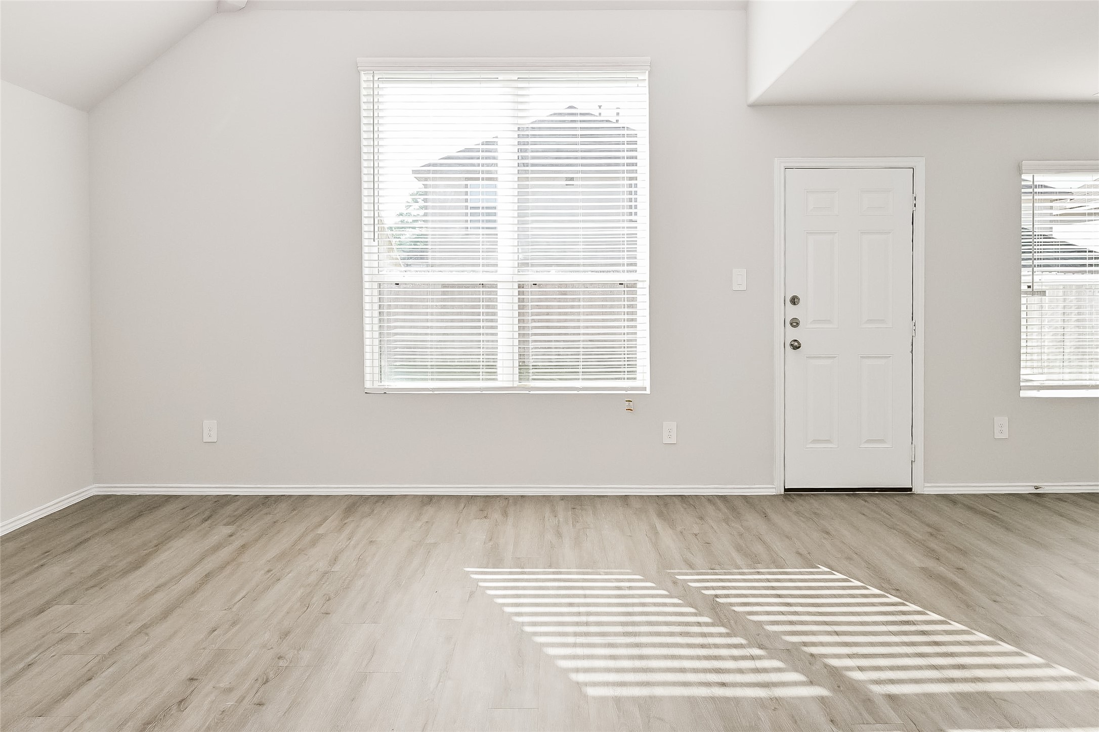 4911 Sweet Chestnut Lane Spring, TX 77373 - Photo 6 of 18 a view of a room with wooden floor and windows