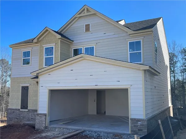 a front view of a house with a garage