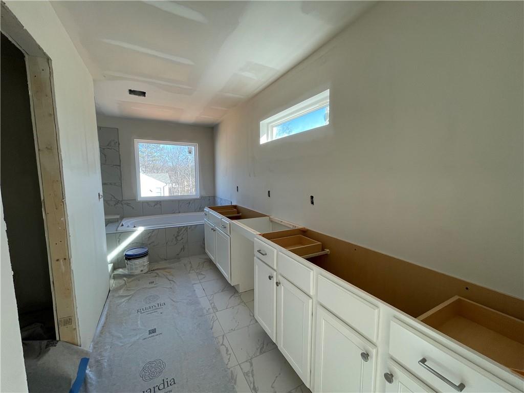 100 Bridgeview (lot 1) Way Canton, GA 30114 - Photo 18 of 31 a kitchen with a sink and cabinets