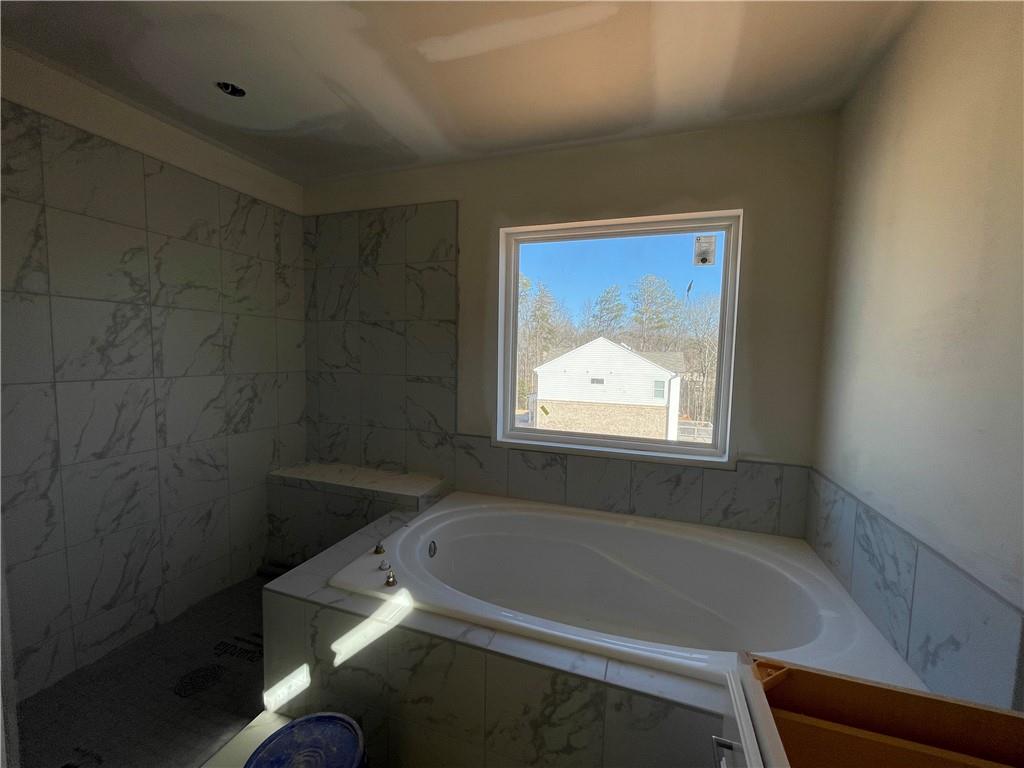 100 Bridgeview (lot 1) Way Canton, GA 30114 - Photo 19 of 31 a bathroom with a bathtub and window