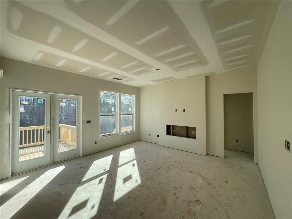 100 Bridgeview (lot 1) Way Canton, GA 30114 - Photo 2 of 21 a living room with a large window and chandelier