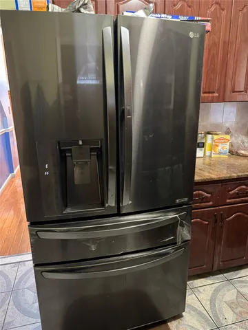 a stove top oven sitting inside of a kitchen