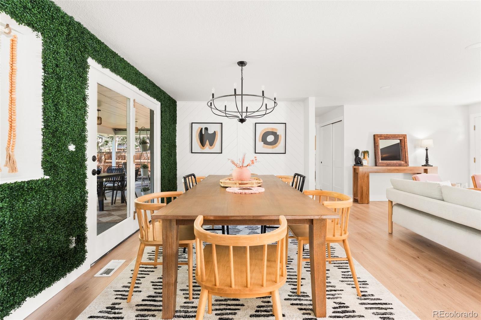6115 Chase Street Arvada, CO 80003 - Photo 13 of 45 a view of a dining room with furniture window and wooden floor