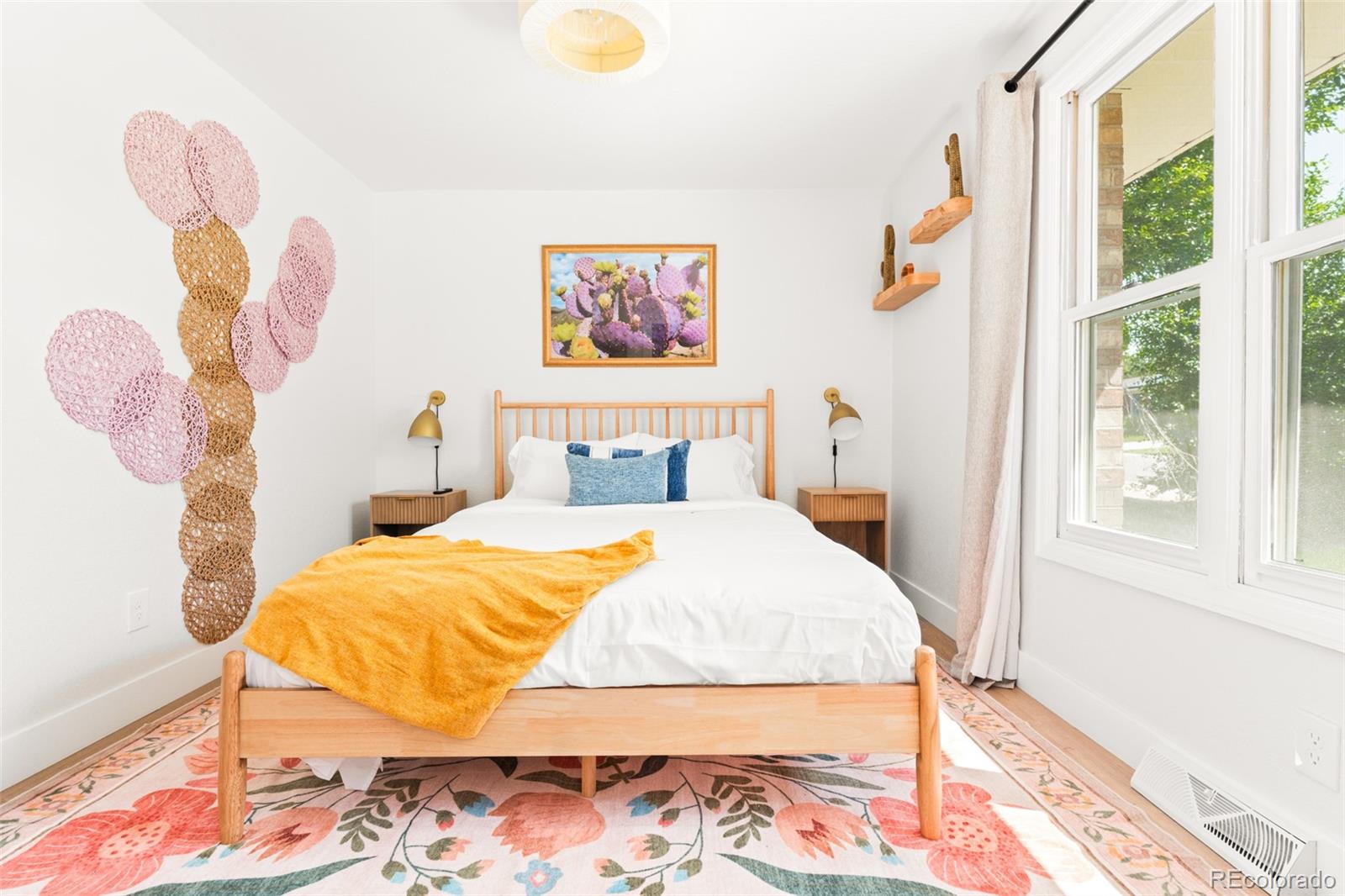 6115 Chase Street Arvada, CO 80003 - Photo 15 of 45 a bedroom with a bed and a window