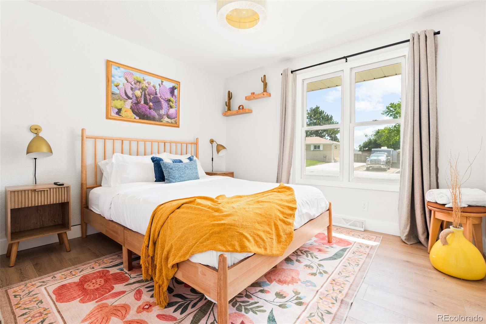 6115 Chase Street Arvada, CO 80003 - Photo 16 of 45 a bedroom with a bed and a window
