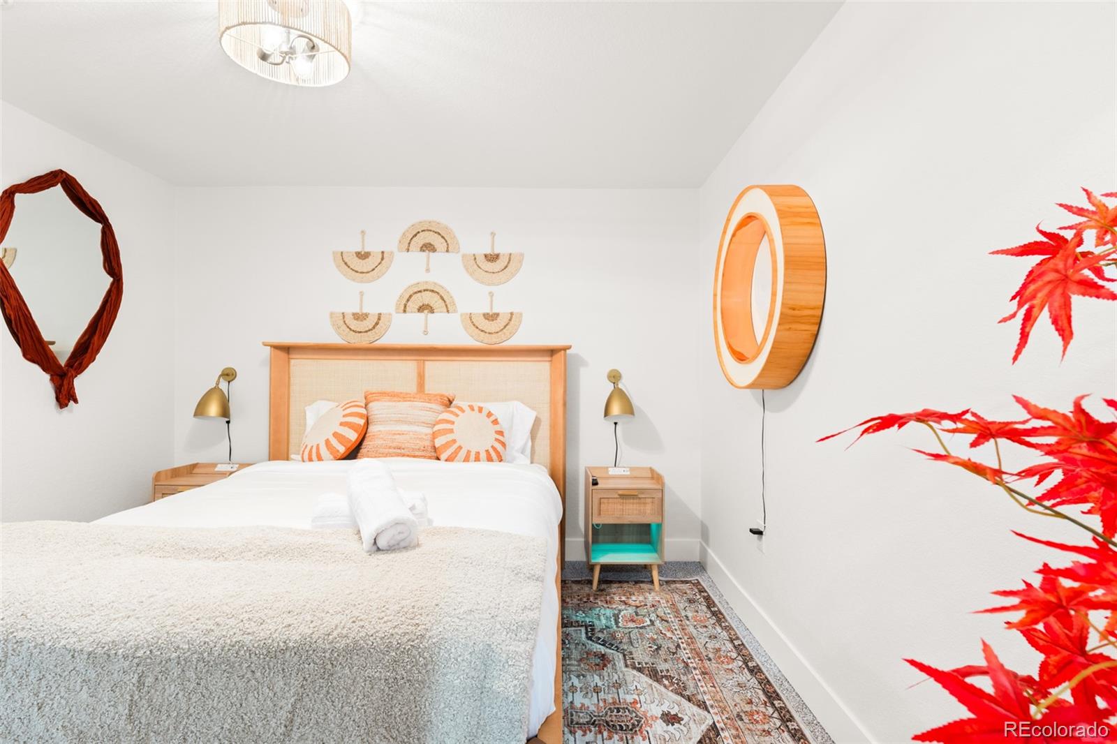 6115 Chase Street Arvada, CO 80003 - Photo 18 of 45 a bedroom with a bed a mirror and a table