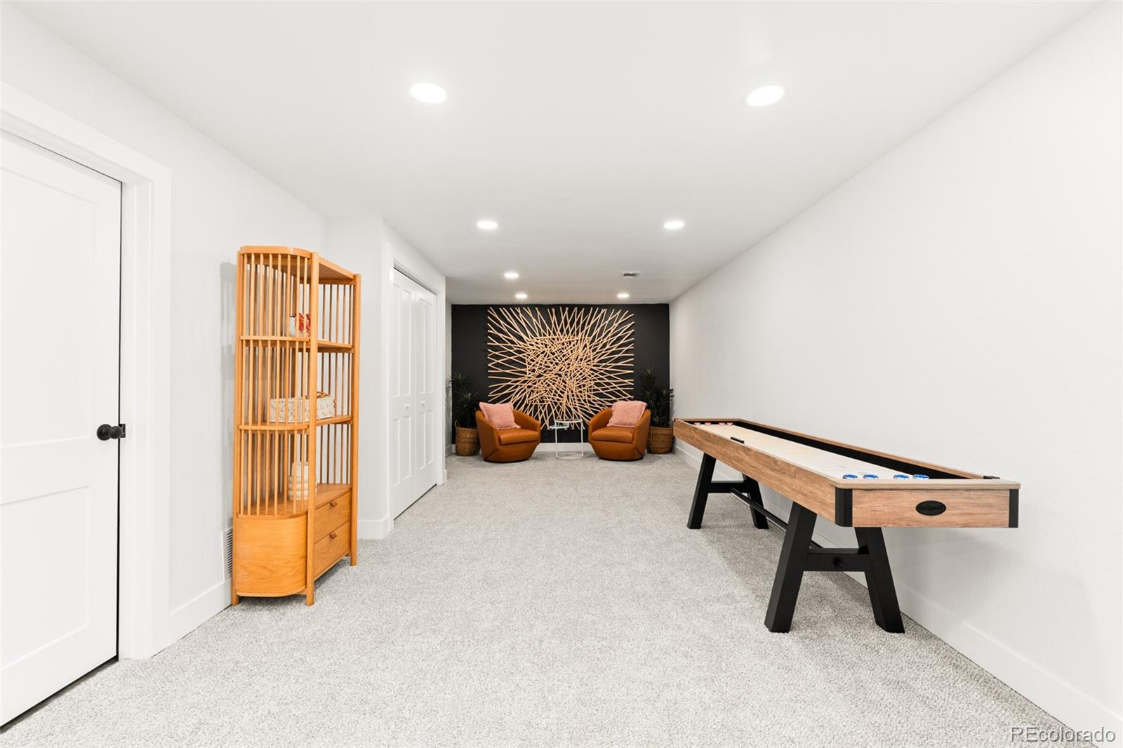 6115 Chase Street Arvada, CO 80003 - Photo 23 of 45 a room with furniture and gym equipment