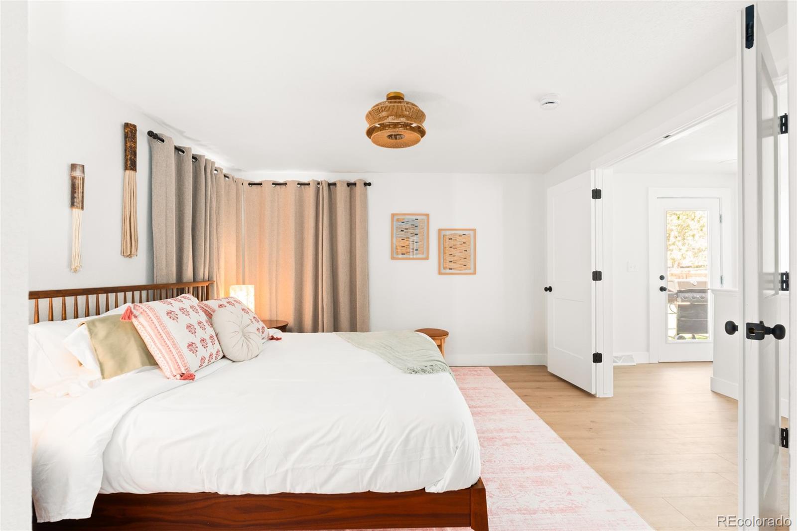 6115 Chase Street Arvada, CO 80003 - Photo 34 of 45 a bedroom with a bed and a window