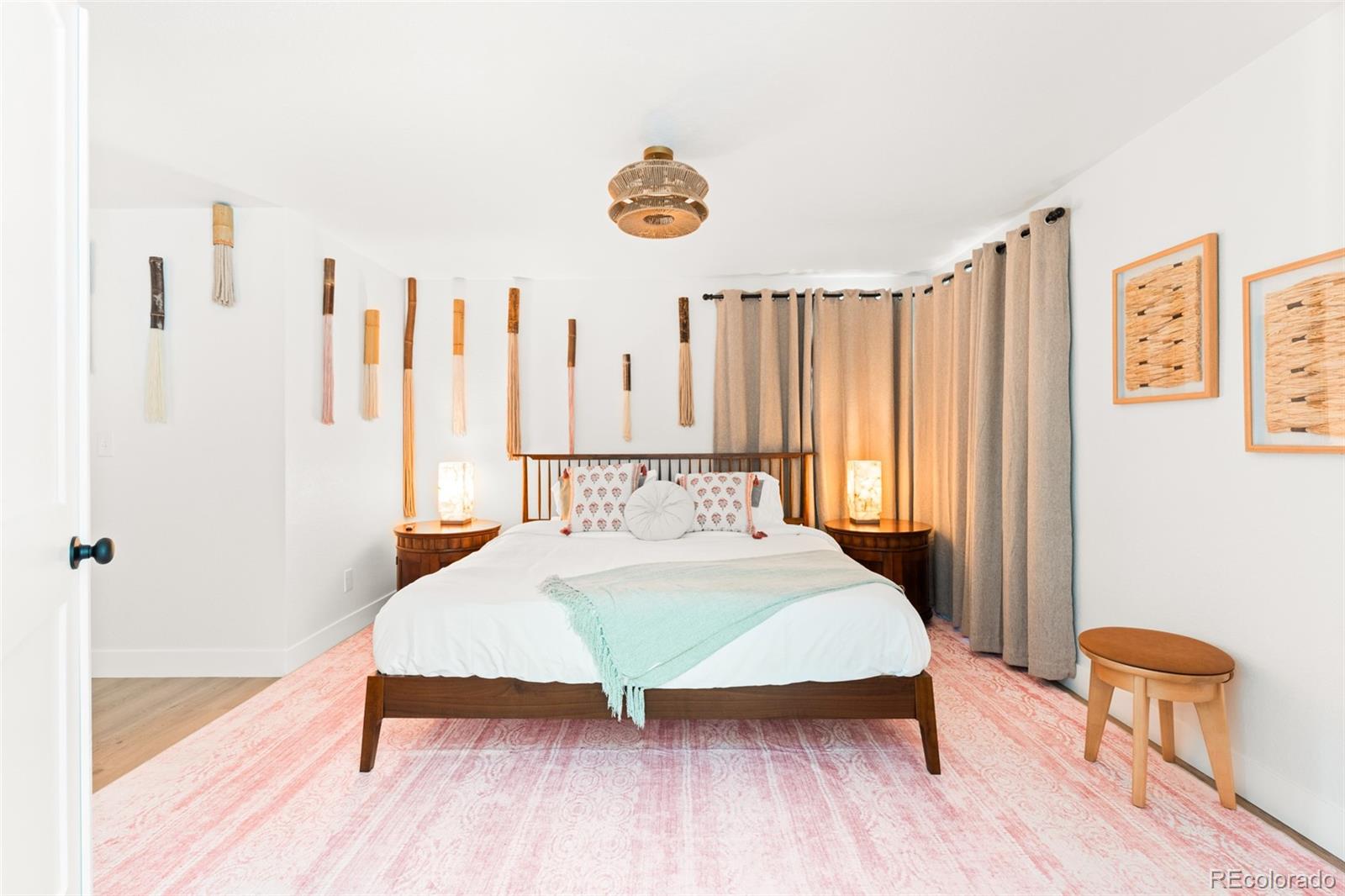 6115 Chase Street Arvada, CO 80003 - Photo 35 of 45 a bedroom with a bed and a table