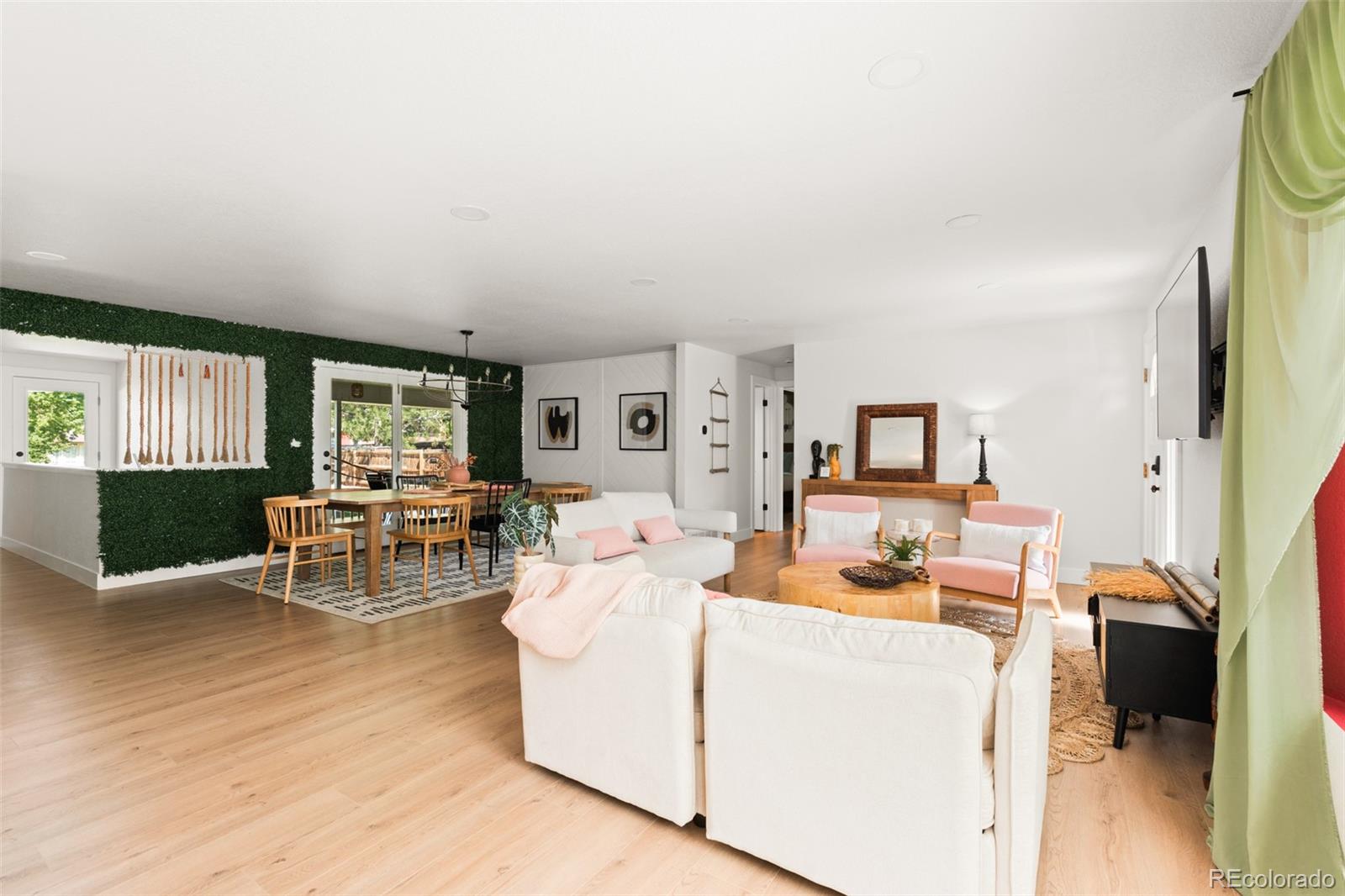 6115 Chase Street Arvada, CO 80003 - Photo 4 of 45 a living room with furniture and a table