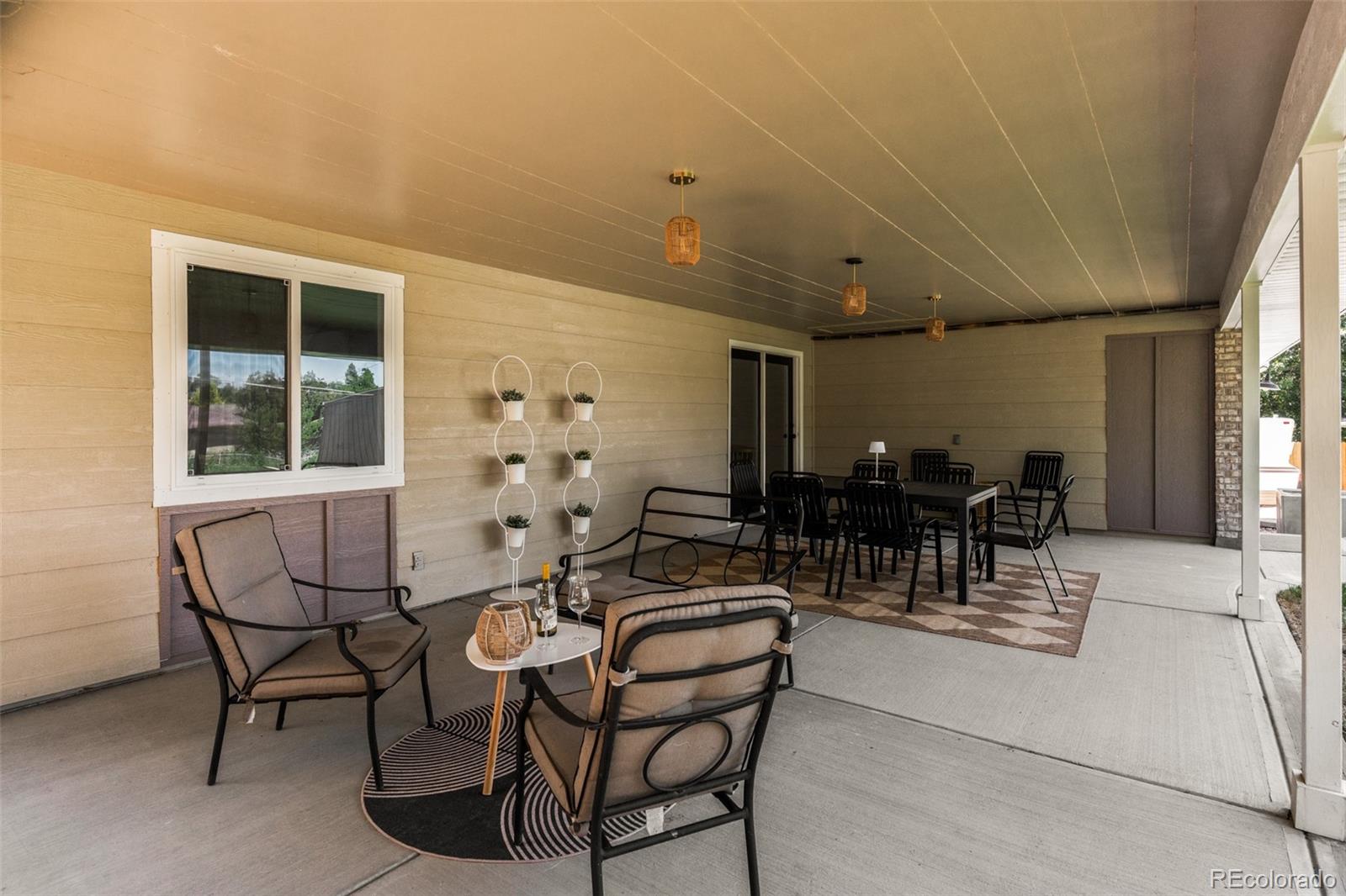 6115 Chase Street Arvada, CO 80003 - Photo 43 of 45 a room with lots of chairs and white walls