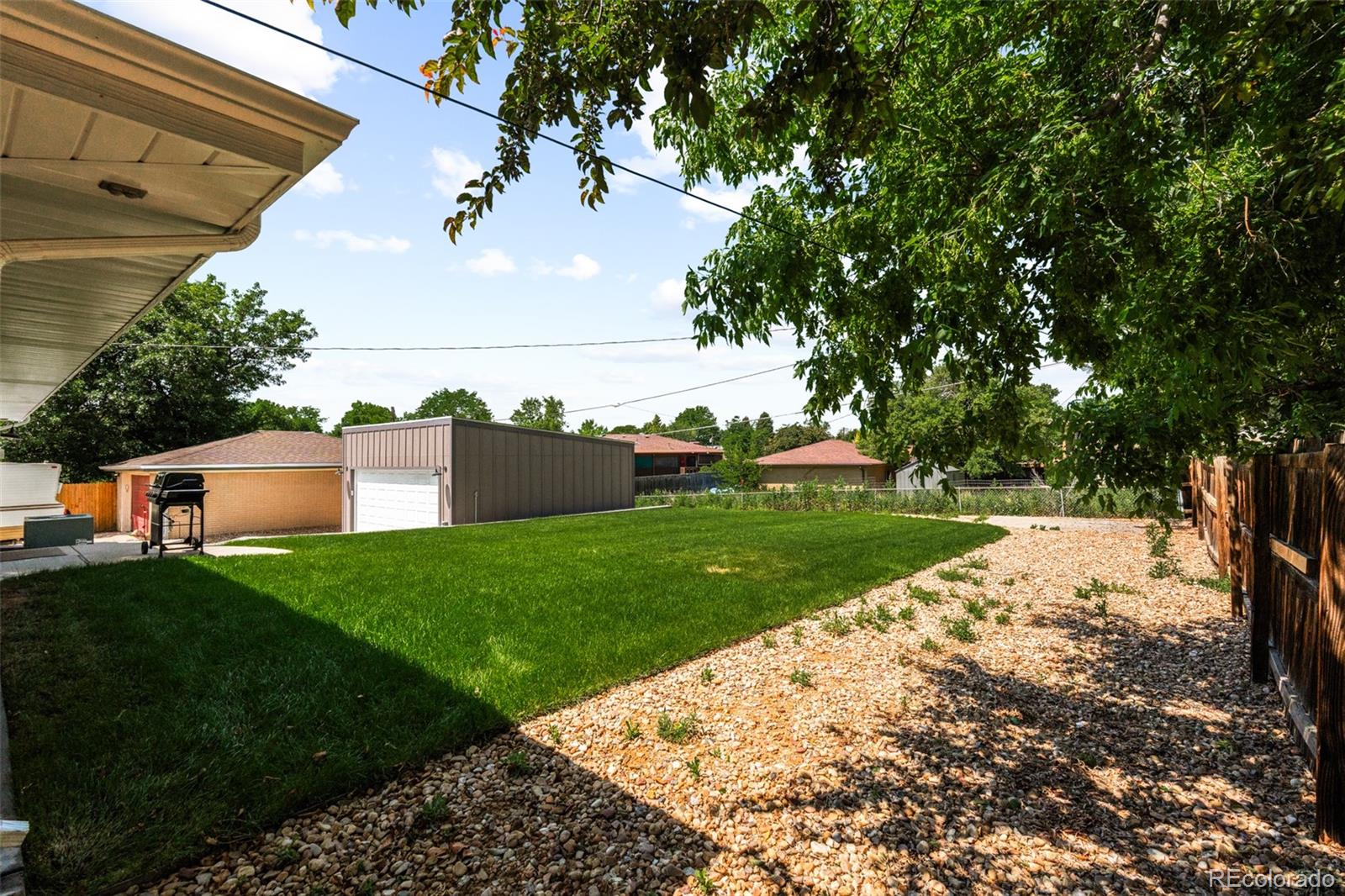 6115 Chase Street Arvada, CO 80003 - Photo 45 of 45 a view of a backyard with large trees