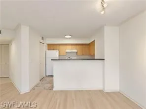 a view of kitchen with wooden floor