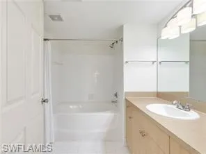 a bathroom with a sink and a shower