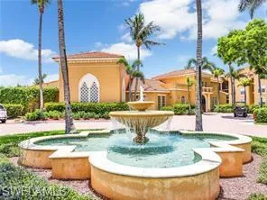 a view of a fountain in front of a house