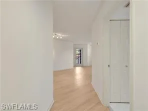 a view of a hallway with a white walls