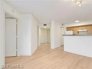 a view of a kitchen cabinets and a window