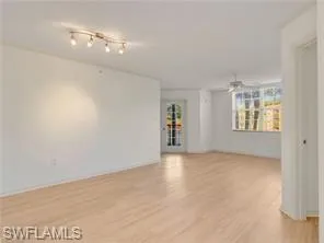 a view of an empty room with a window
