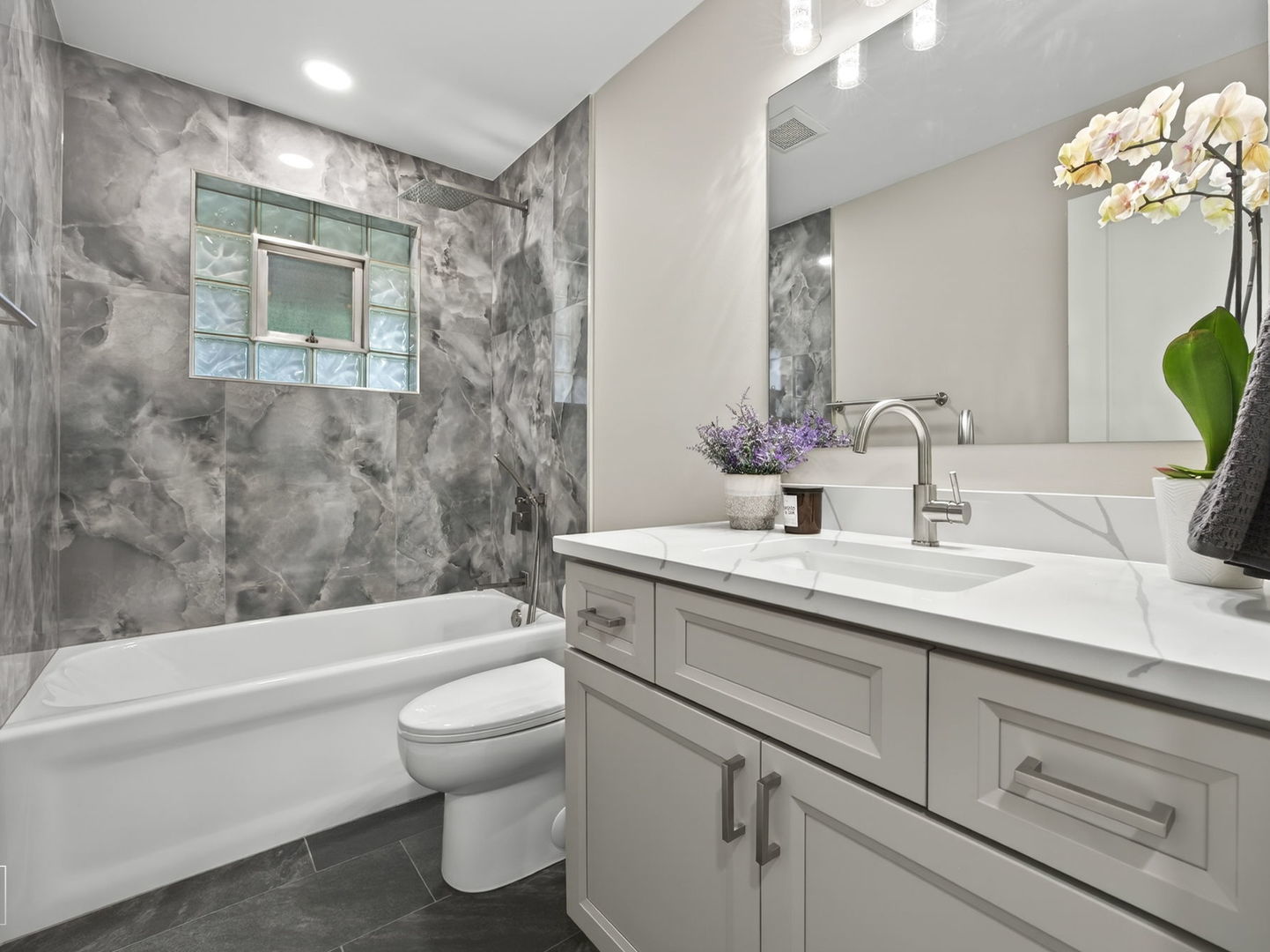 1011 Maitland Drive Lockport, IL 60441 - Photo 12 of 23 a bathroom with a sink a toilet and shower