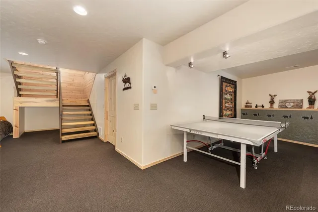 a room with wooden furniture and white walls