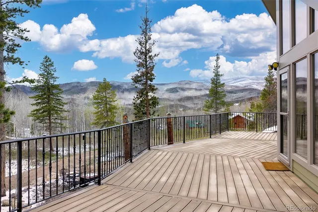 a view of a balcony with two chairs