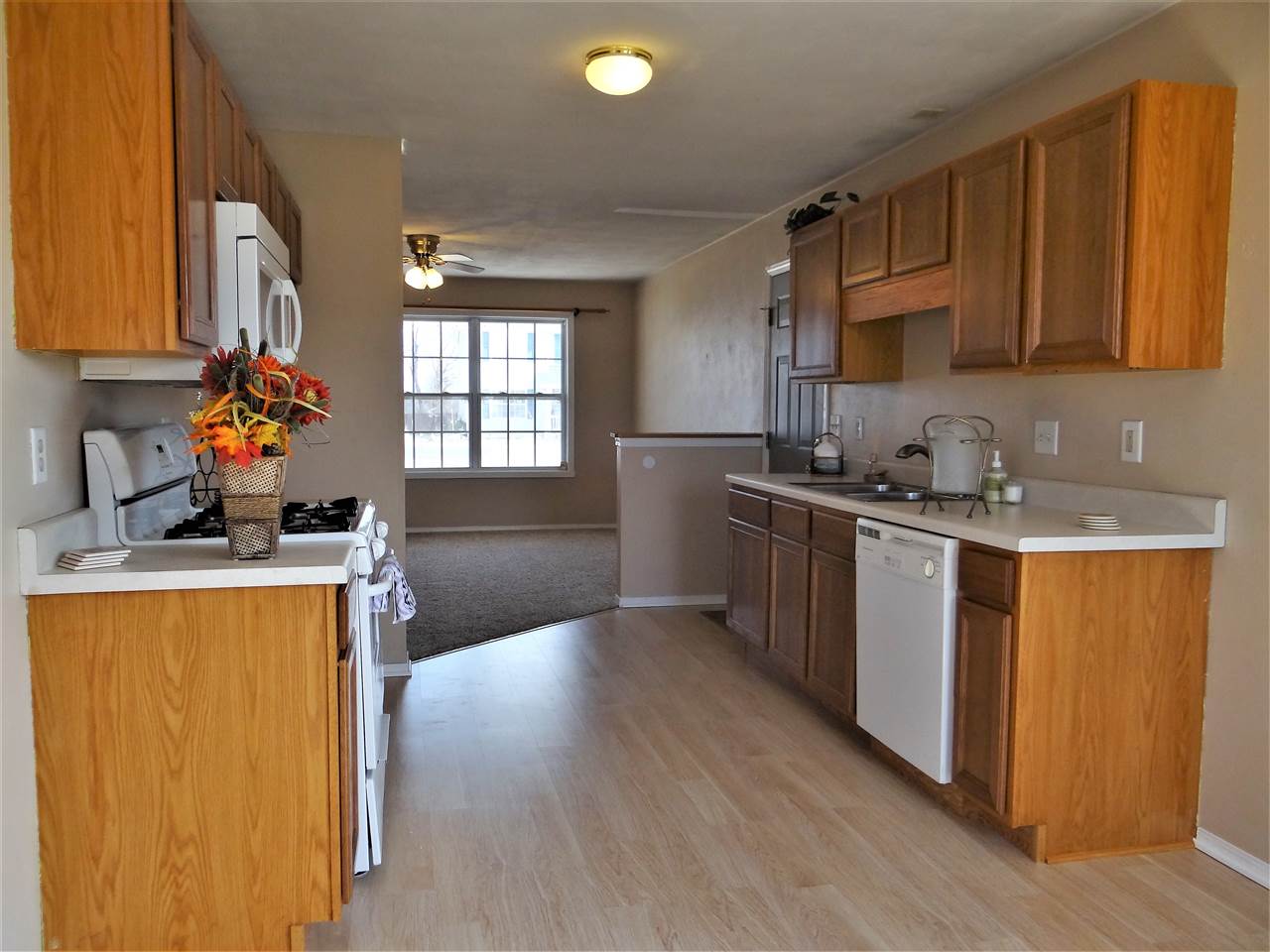628 Bayfield Road Rockton, IL 61072 - Photo 6 of 24 a kitchen with stainless steel appliances granite countertop a sink stove and refrigerator