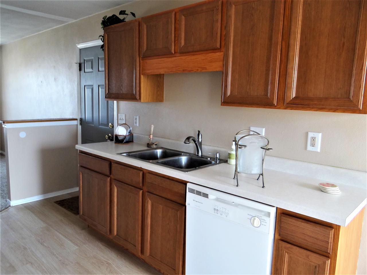 628 Bayfield Road Rockton, IL 61072 - Photo 7 of 24 a kitchen with stainless steel appliances granite countertop a sink stove and cabinets
