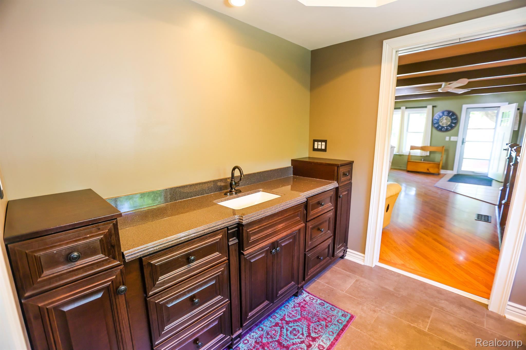 15183 Fish Lake Road Holly, MI 48442 - Photo 23 of 34 Laundry Room w/ Granite Counter & Custom Vanity!