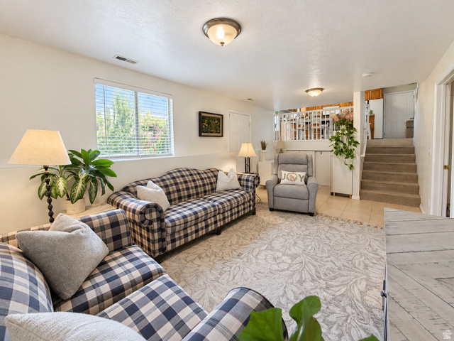 452 North 600 East Springville, UT 84663 - Photo 8 of 26 Recessed window with blinds, overhead lighting, tiled flooring, carpeted stairs, and a white balustrade