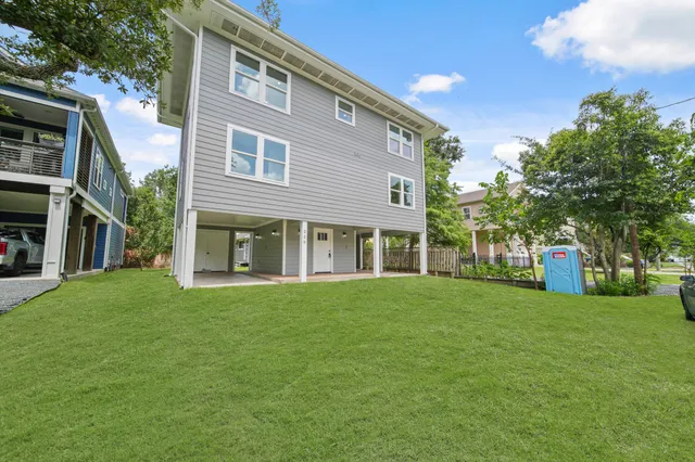 a front view of a building with a garden