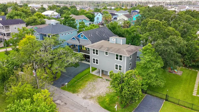an aerial view of a house with a yard and a yard