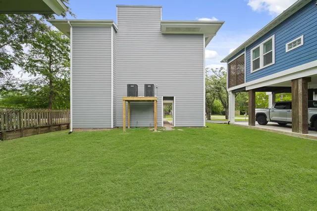 a view of a house with backyard and porch
