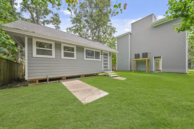 a backyard that has a large tree