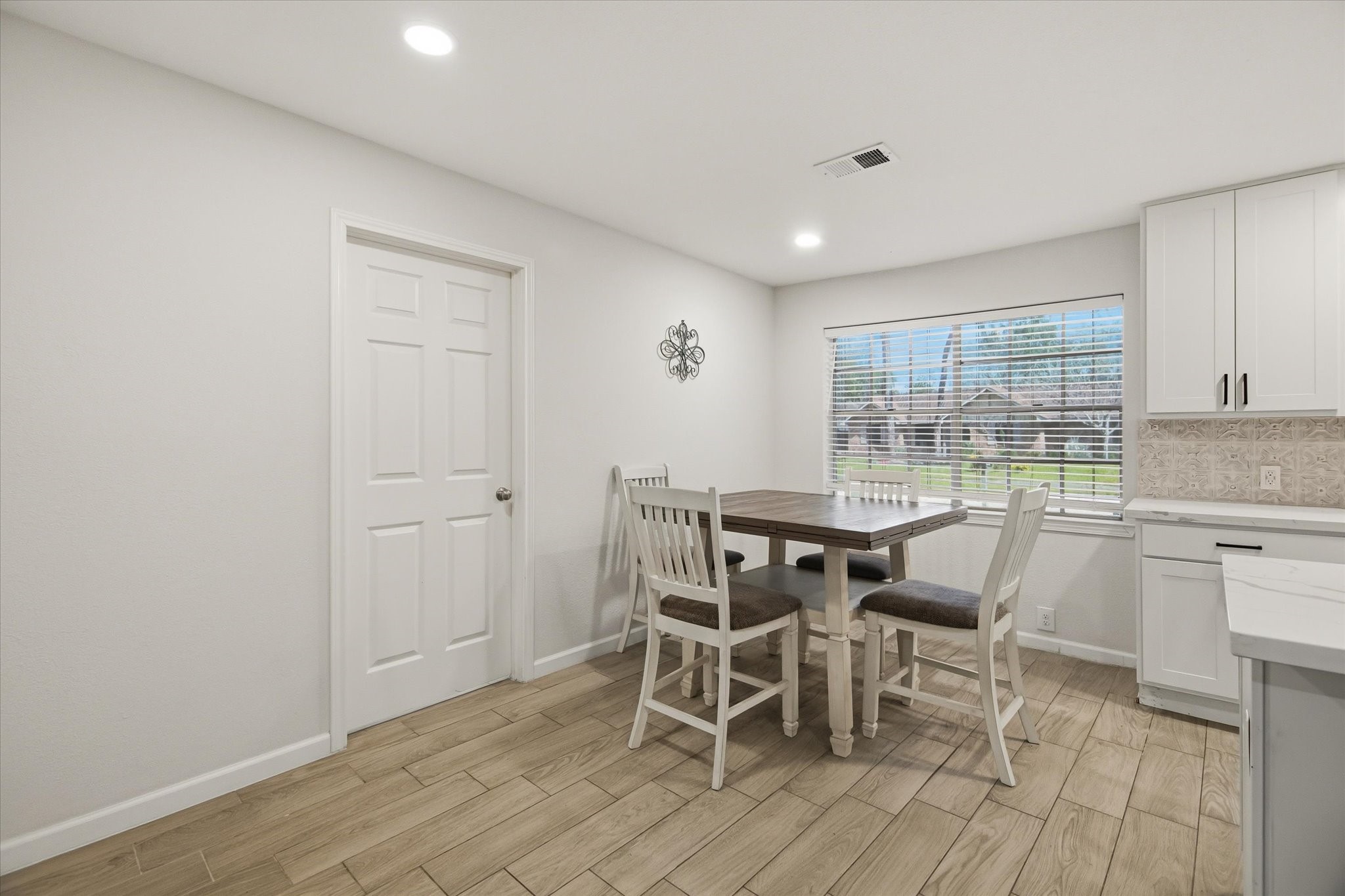 113 Rose Trail Lake Jackson, TX 77566 - Photo 11 of 45 a dining room with furniture and wooden floor