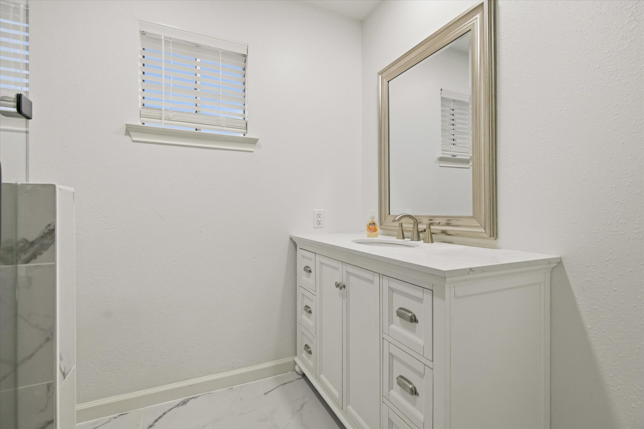 113 Rose Trail Lake Jackson, TX 77566 - Photo 26 of 45 a bathroom with 2 sink and a mirror