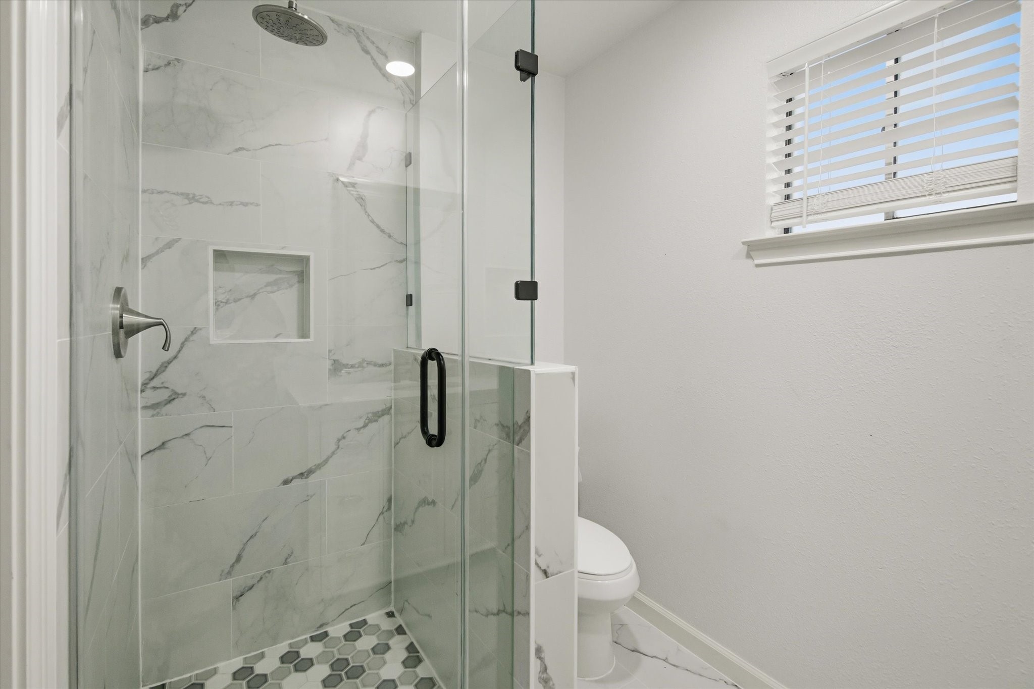 113 Rose Trail Lake Jackson, TX 77566 - Photo 27 of 45 a bathroom with a granite countertop shower a toilet and a sink