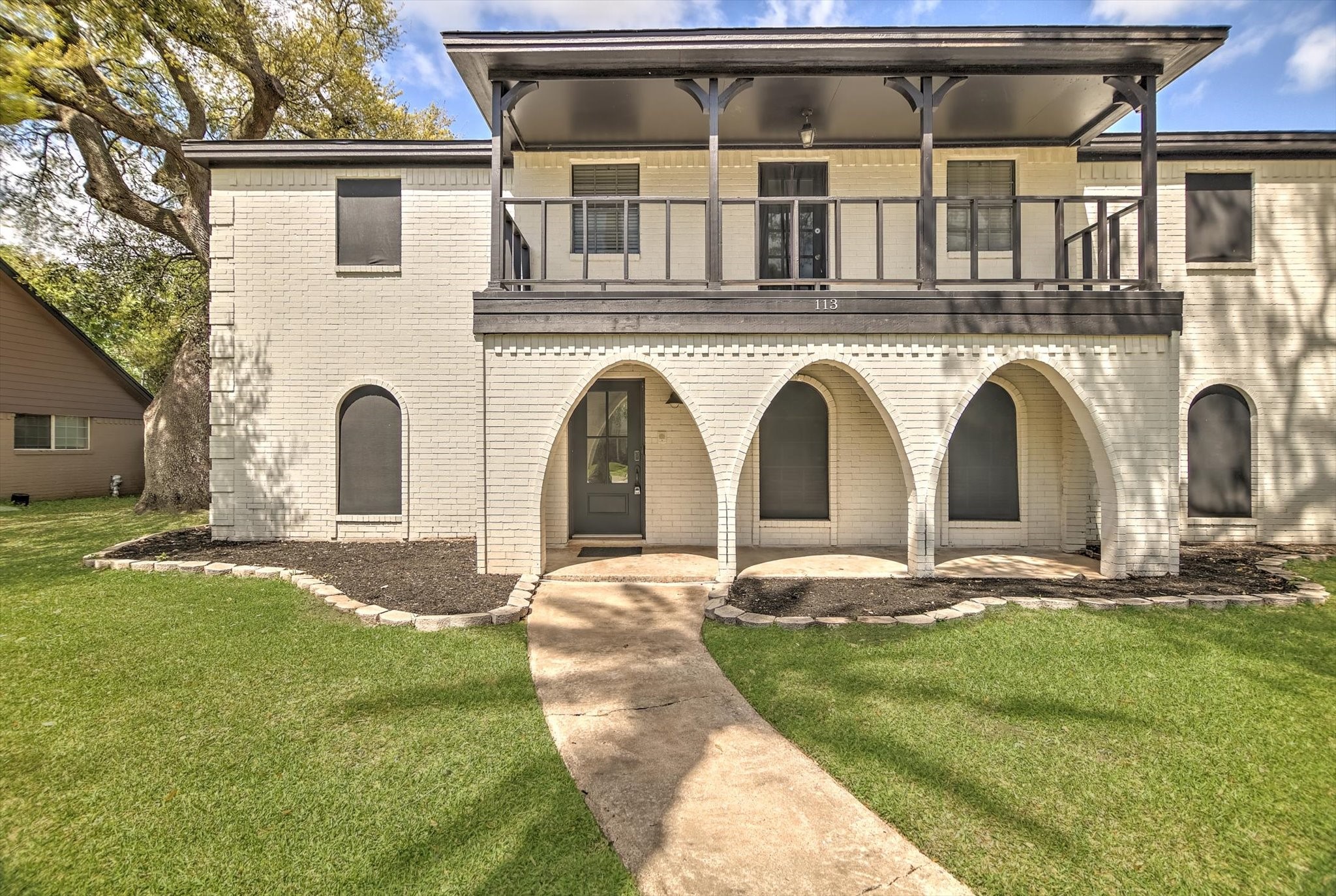 113 Rose Trail Lake Jackson, TX 77566 - Photo 2 of 45 a front view of a house with garden
