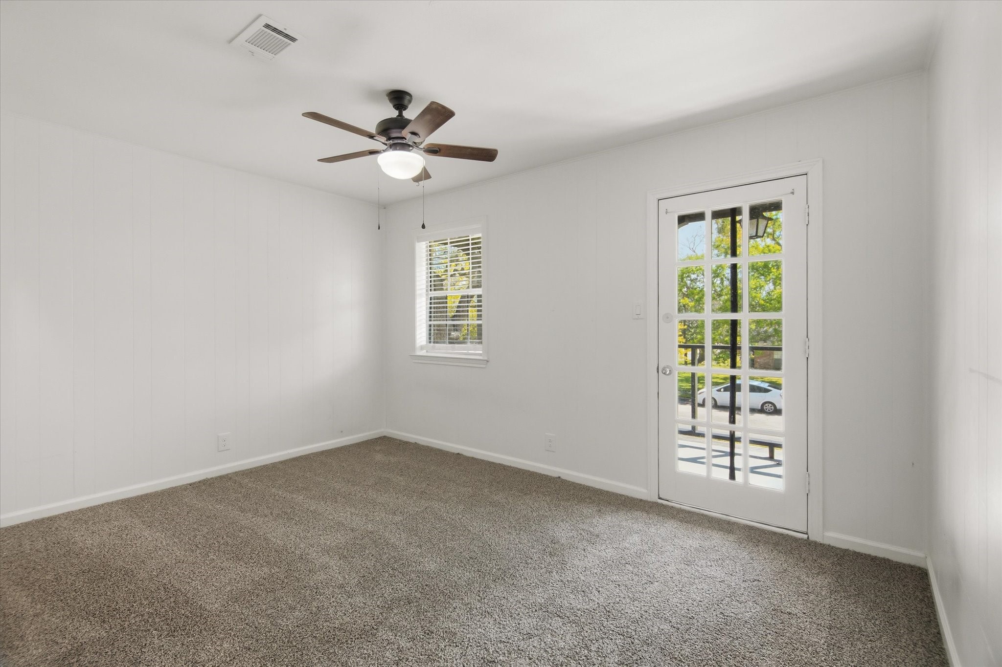 113 Rose Trail Lake Jackson, TX 77566 - Photo 30 of 45 an empty room with windows and fan