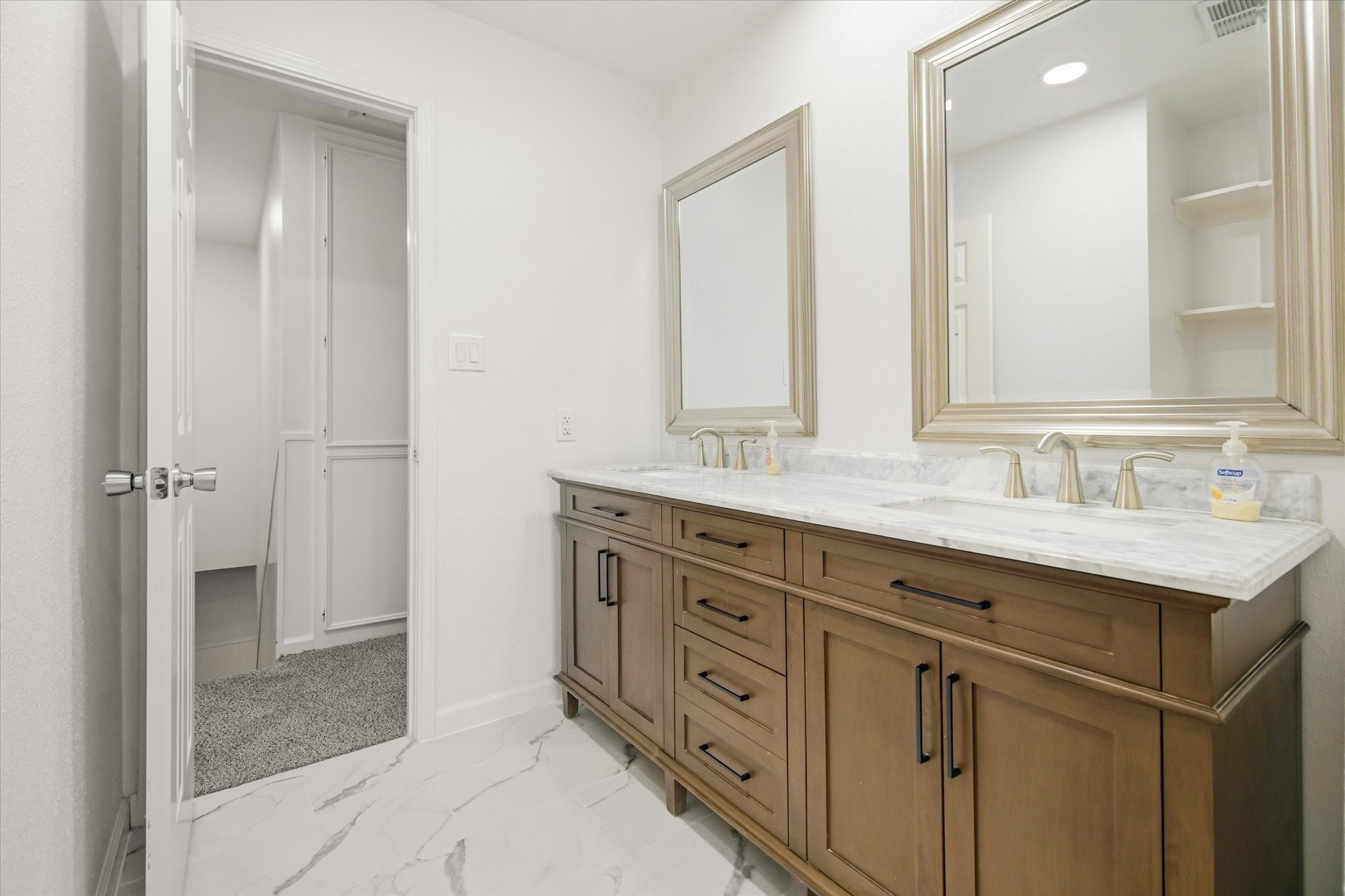 113 Rose Trail Lake Jackson, TX 77566 - Photo 37 of 45 a bathroom with double sink and a mirror
