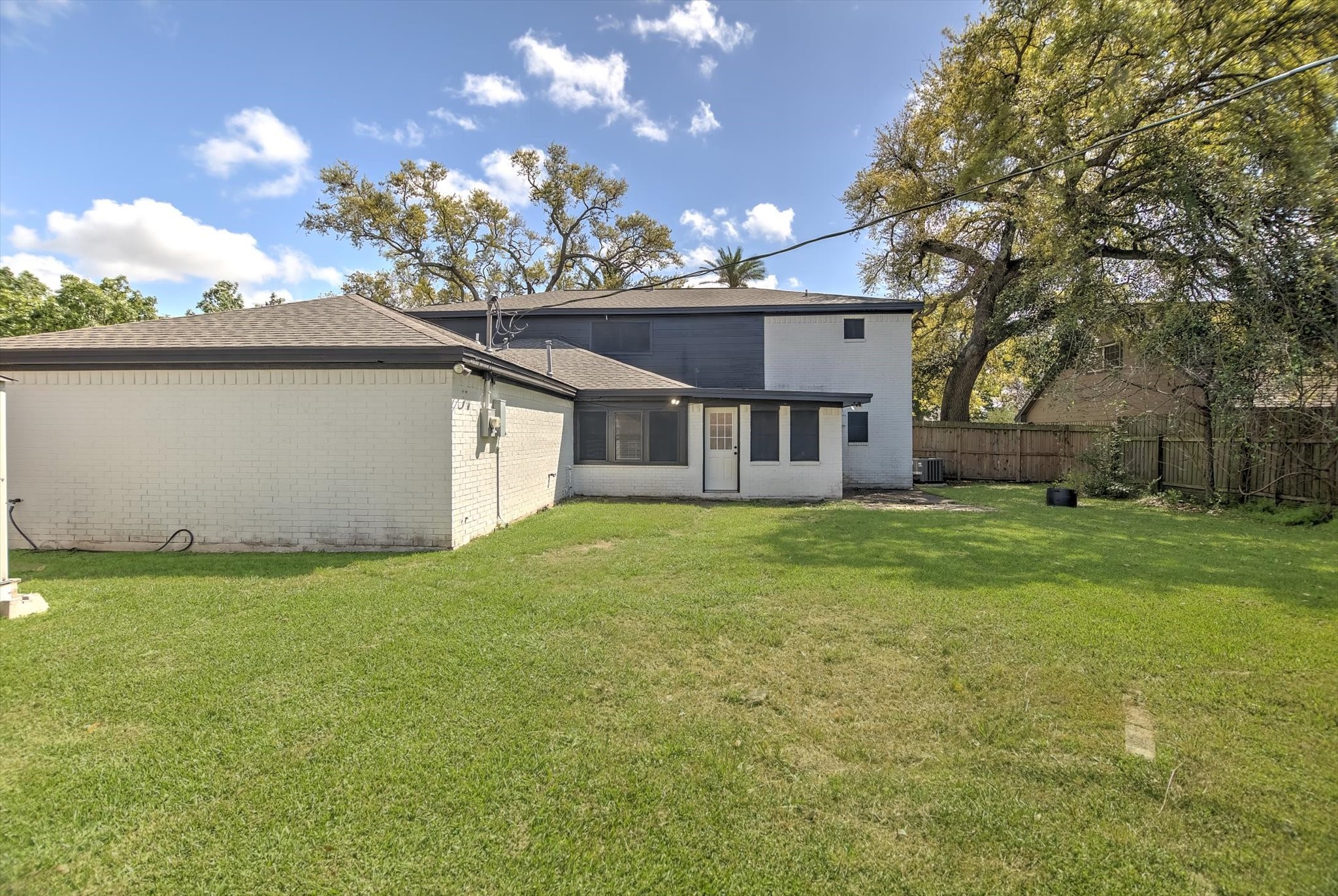 113 Rose Trail Lake Jackson, TX 77566 - Photo 43 of 45 a view of a house with a backyard