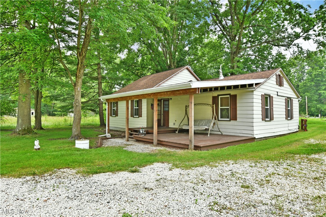 5578 Shaffer Road Northwest Warren, OH 44481 - Photo 7 of 48 View of front of property featuring a porch, a front yard, and a shingled roof