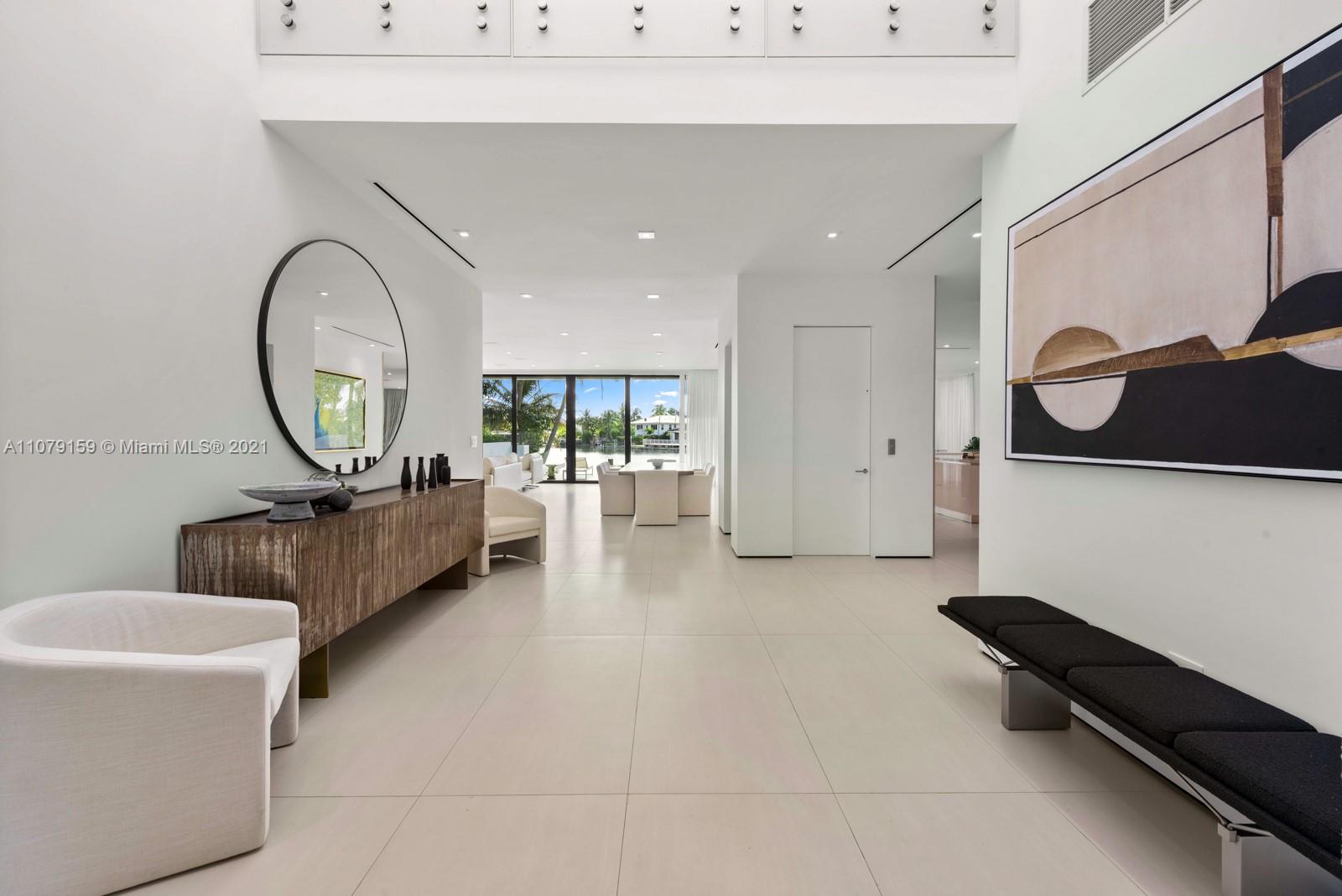 1413 Biscaya Drive Surfside, FL 33154 - Photo 15 of 35 a living room with furniture and a large window