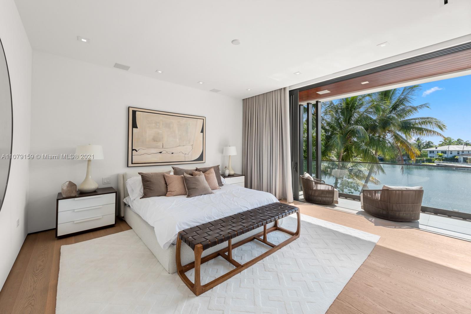 1413 Biscaya Drive Surfside, FL 33154 - Photo 17 of 35 a living room with furniture rug and a large window