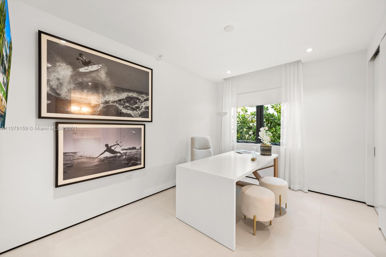 1413 Biscaya Drive Surfside, FL 33154 - Photo 21 of 35 a room with furniture and painting on the wall