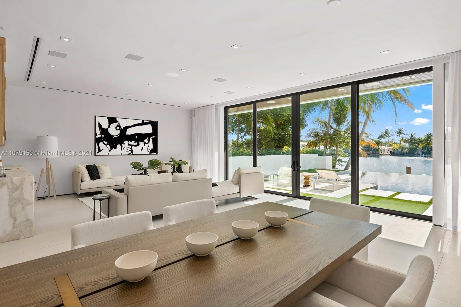 1413 Biscaya Drive Surfside, FL 33154 - Photo 4 of 35 a living room with furniture and a large window